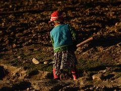 15 Child In Colourful Clothing Tilling The Field At Sunset In Yilik Village On The Way To K2 China Trek
